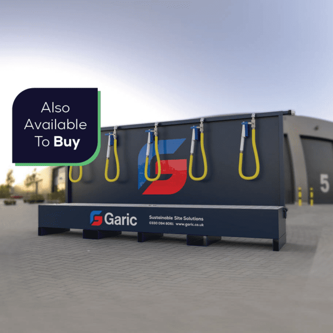 Large industrial Bootwash equipment with hoses, labeled Garic, outside a warehouse; sign reads Also Available To Buy.