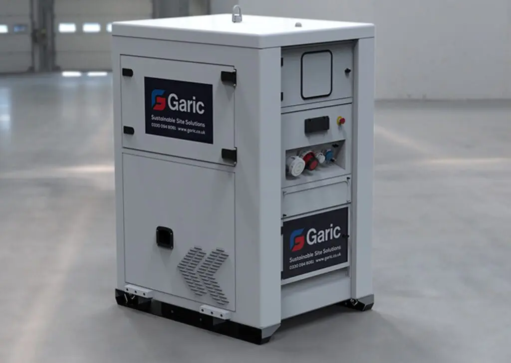 White Battery Energy Store unit with Garic logo, located in a spacious indoor area with a concrete floor.