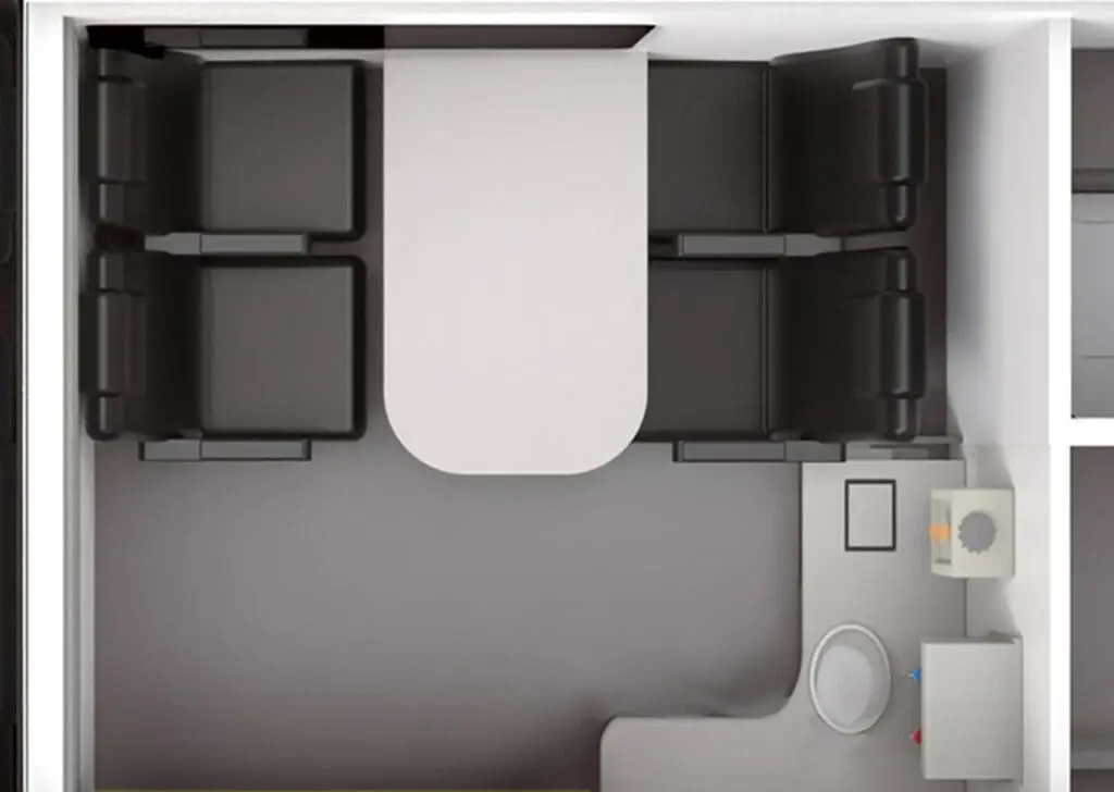 Top-down view of a Welfare Van with four chairs, a table, a toilet, and a sink in the corner.