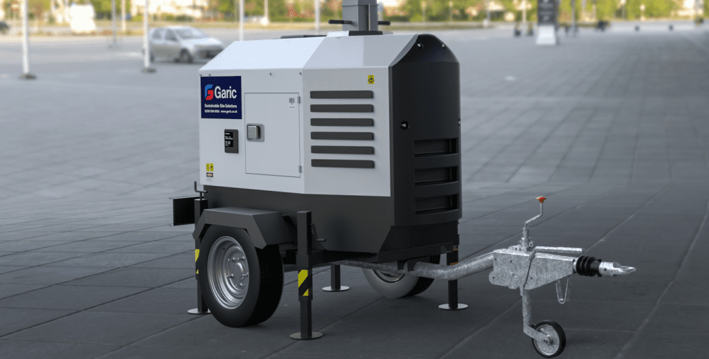 An Eco Tower Light, a portable generator on a trailer, is parked on a paved surface outdoors.