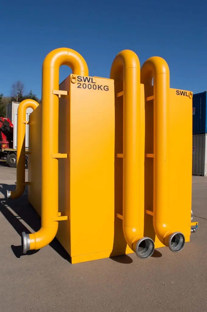 Large yellow industrial container with pipes and SWL 2000KG labeled on it, positioned outdoors.
