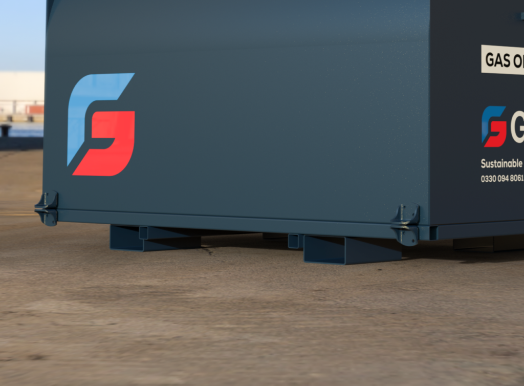 Blue dumpster on concrete with red and blue logo and visible signage on the side.