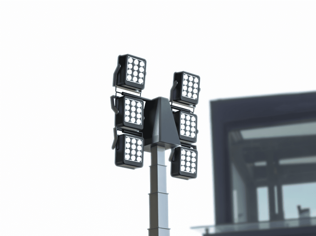 The Eco Tower Light is a tall pole featuring six rectangular LED floodlights, installed in front of a building with a white sky background.
