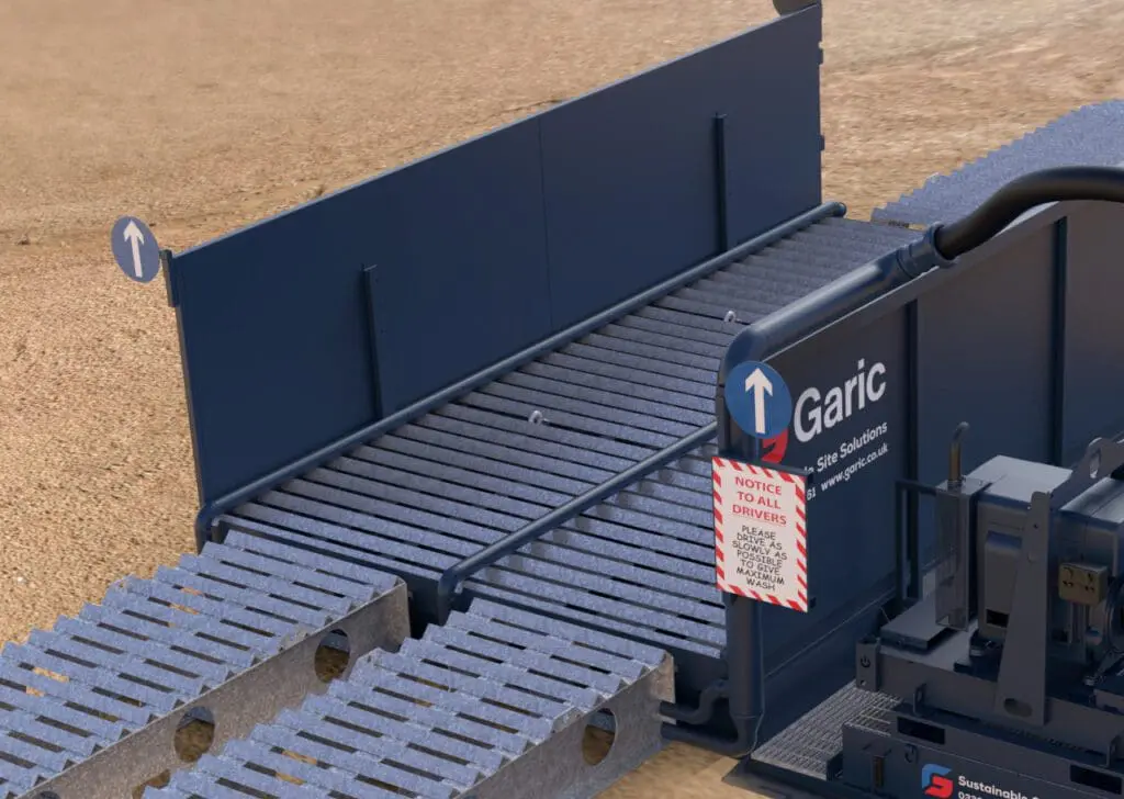 Enviro Wheel Wash 24 with Garic branding and warning sign, installed on sandy ground.