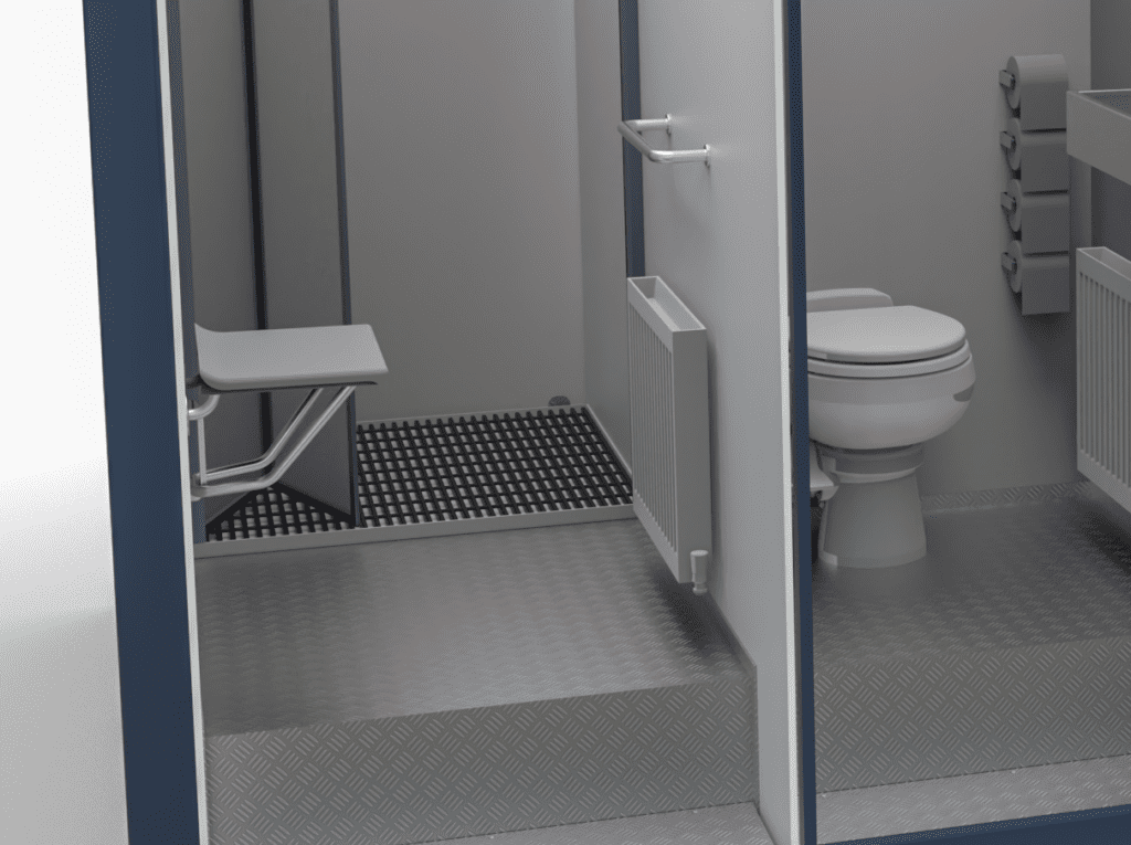 The 1+1 Toilet Block 10 offers an accessible restroom with a toilet, foldable shower seat, grab bars, and textured floors for enhanced safety.