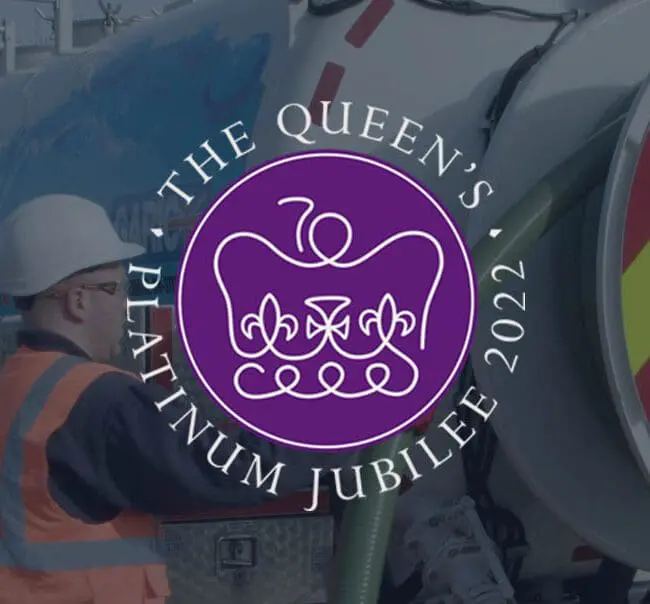 A worker in safety gear stands by a truck with the Queens Platinum Jubilee 2022 logo overlaid.