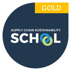Gold badge for Supply Chain Sustainability School with interlocking blue and green rings in SCHOOL.