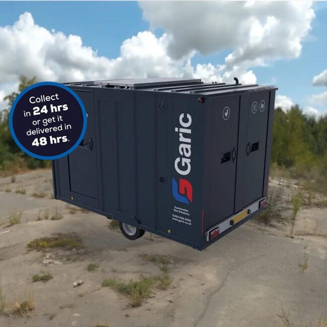 An Armadillo 12 Eco portable unit outdoors with a sign: Collect in 24 hrs or get it delivered in 48 hrs.