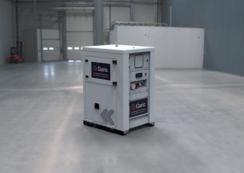 A white Battery Energy Store unit is placed in a large, empty industrial warehouse.