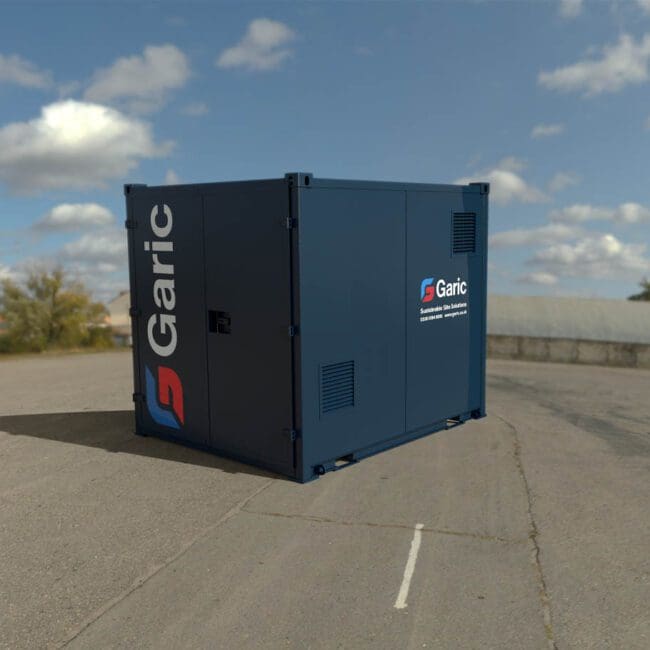 A blue COSHH Store 10 unit sits on an empty paved lot under a partly cloudy sky.
