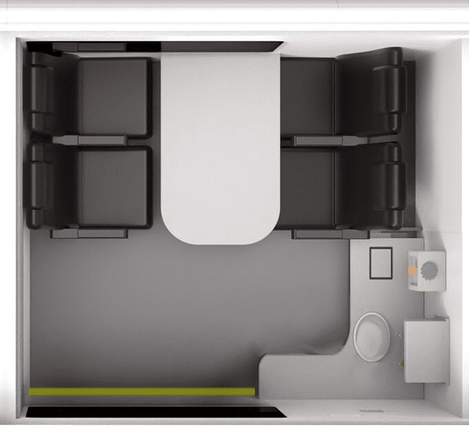 Top view of the Welfare Van Eco showing a compact room with four chairs, a table, a toilet, sink, and a yellow line on the floor.