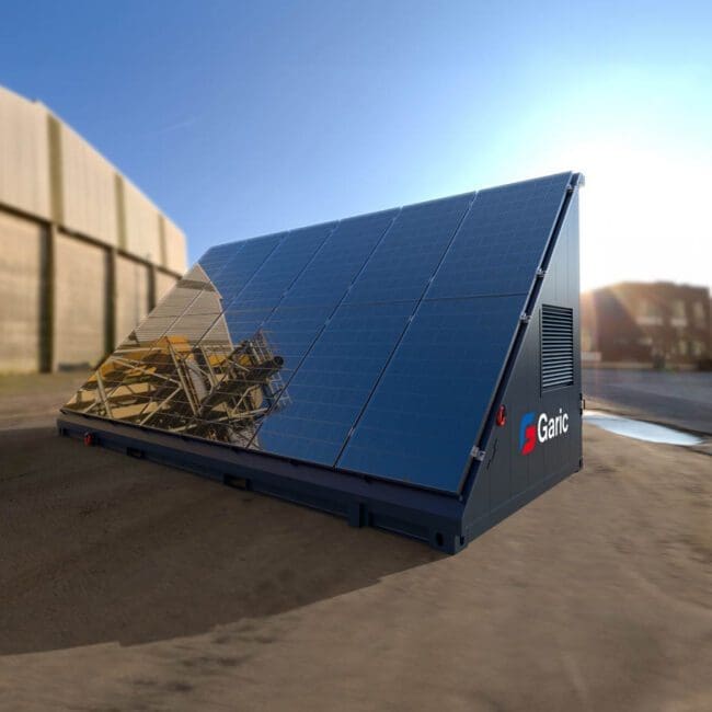 A Solar Energy Store 20 portable solar panel unit is set up on an industrial site beneath a clear blue sky.