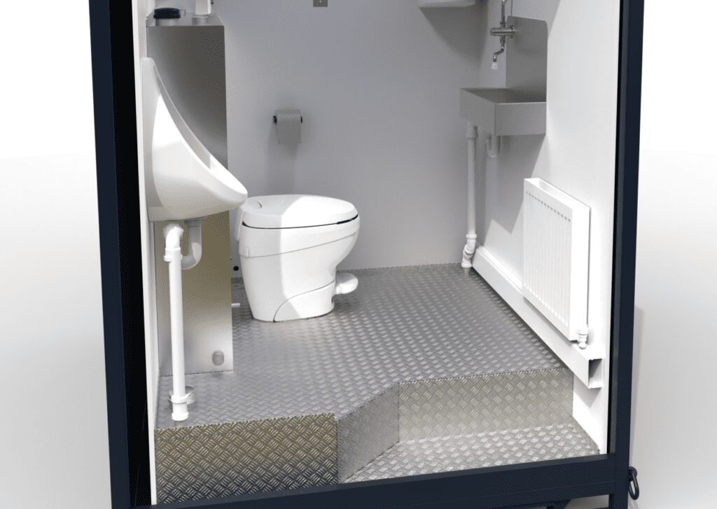The Solar Loo 8 features an accessible bathroom with a raised textured floor, toilet, urinal, sink, and wall-mounted radiator.